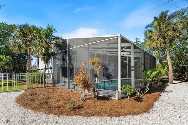 exterior space with a fenced in pool