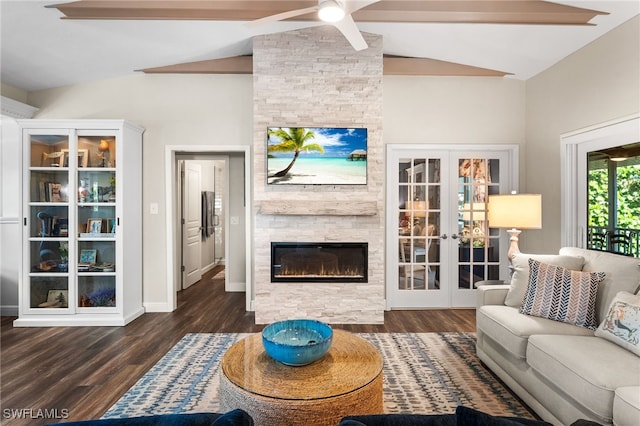 living room with a stone fireplace, french doors, dark hardwood / wood-style floors, lofted ceiling with beams, and ceiling fan