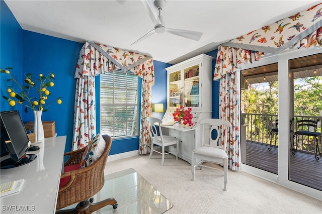 carpeted home office with ceiling fan