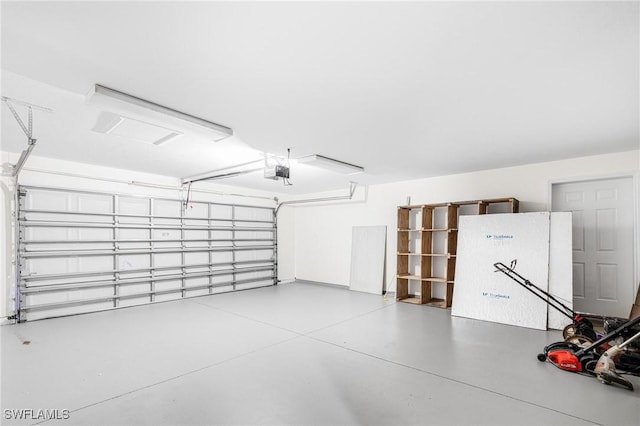 garage with a garage door opener and fridge