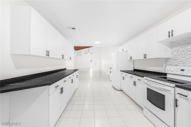 kitchen featuring white cabinetry, white appliances, and light tile patterned floors