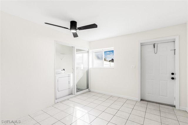 interior space featuring ceiling fan and washer / dryer