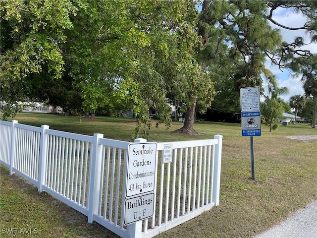 view of gate featuring a yard