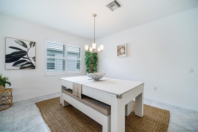 tiled dining room with breakfast area and an inviting chandelier