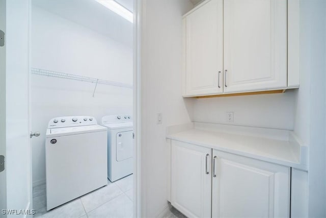 washroom featuring light tile patterned floors and washing machine and dryer