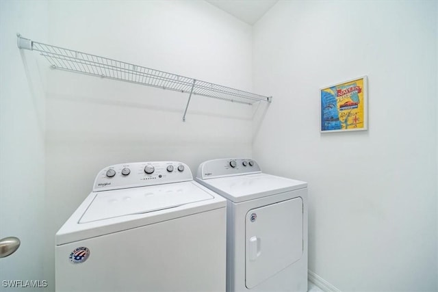 washroom featuring washer and dryer