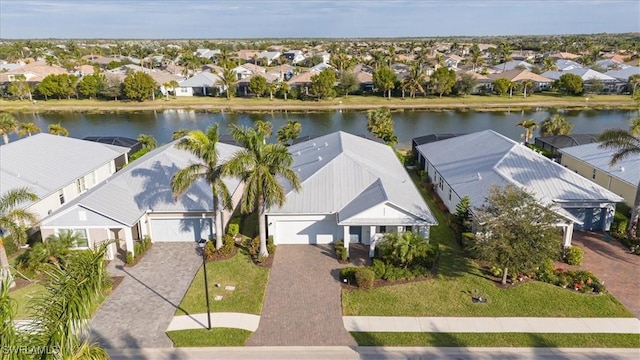 birds eye view of property featuring a water view