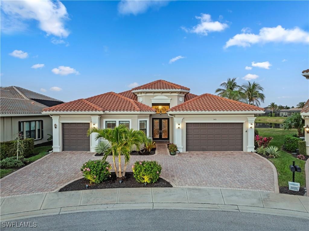 mediterranean / spanish-style house featuring a garage