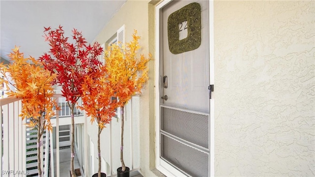 property entrance with a balcony