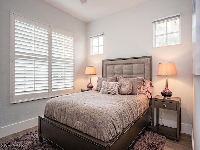 bedroom featuring ceiling fan and wood-type flooring