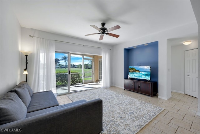 living room featuring ceiling fan