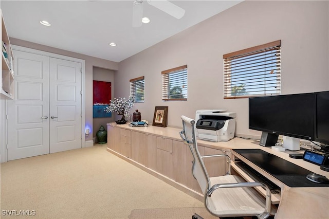 office area featuring light colored carpet and ceiling fan