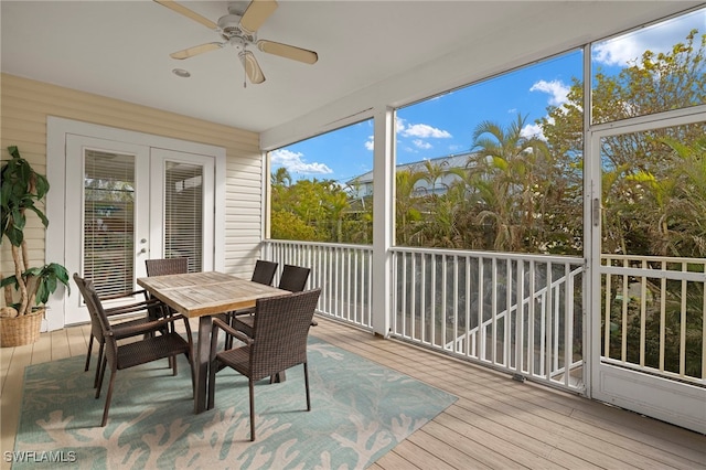 sunroom / solarium featuring ceiling fan