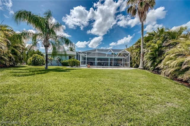 view of yard with a lanai