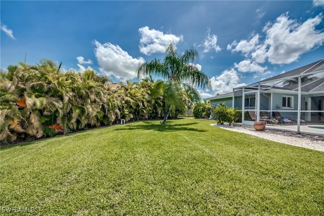 view of yard featuring a lanai