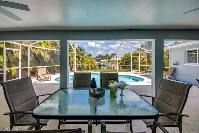 sunroom / solarium with a pool and a healthy amount of sunlight