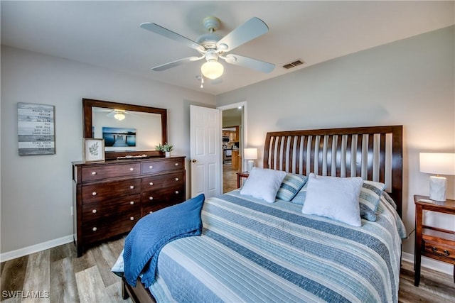 bedroom featuring ceiling fan and light hardwood / wood-style floors