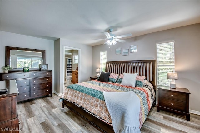 bedroom featuring multiple windows, ceiling fan, and light hardwood / wood-style floors