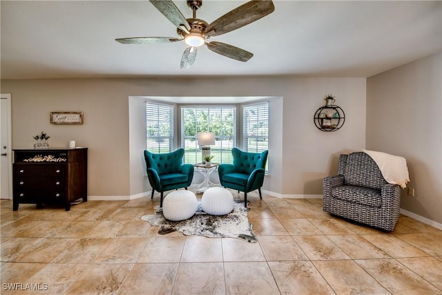 4142 SW 22nd Ct, Cape Coral, FL 33914 - sitting room featuring a ceiling fan, light tile patterned flooring, and baseboards
