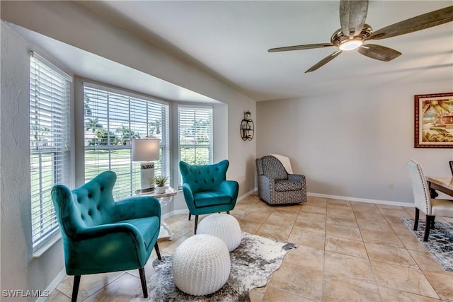 living area featuring ceiling fan