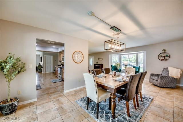 dining space featuring light tile patterned floors