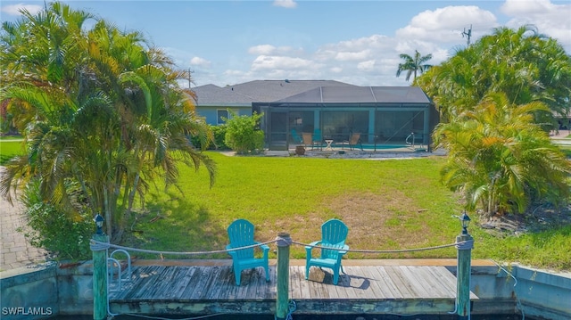 4142 SW 22nd Ct, Cape Coral, FL 33914 - rear view of house featuring a lawn, a lanai, and an outdoor pool
