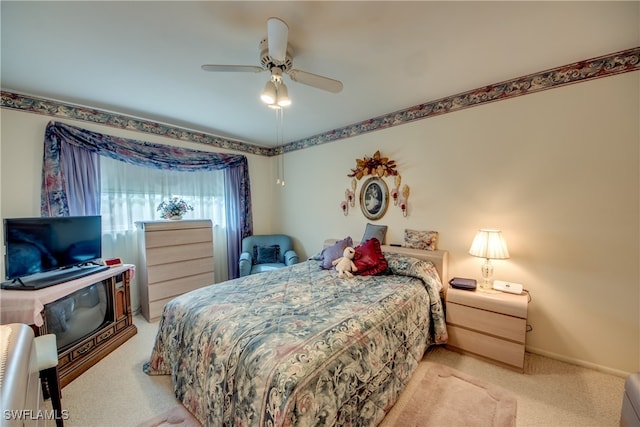 bedroom with light carpet and ceiling fan