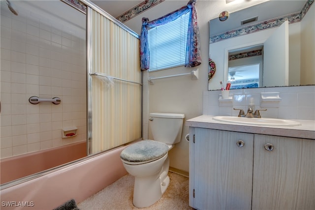 full bathroom with toilet, combined bath / shower with glass door, decorative backsplash, and vanity