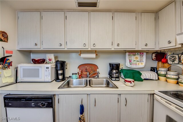 kitchen featuring sink and white appliances