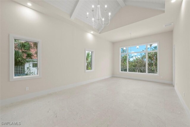 empty room featuring a chandelier, beamed ceiling, wooden ceiling, and high vaulted ceiling