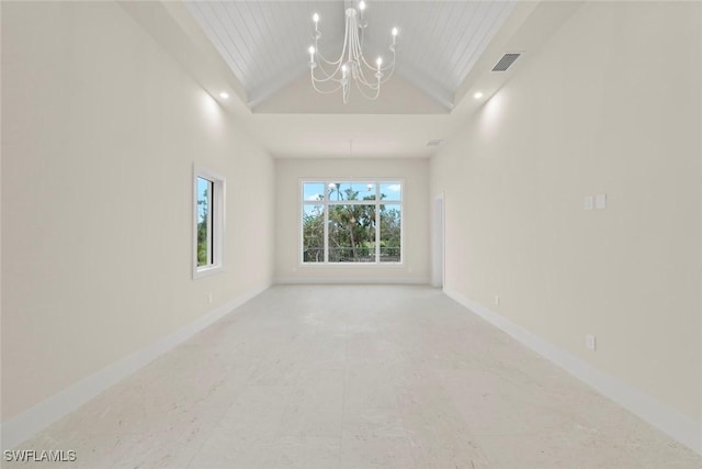 empty room with wooden ceiling and a chandelier