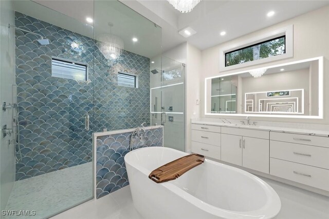 bathroom featuring independent shower and bath and vanity