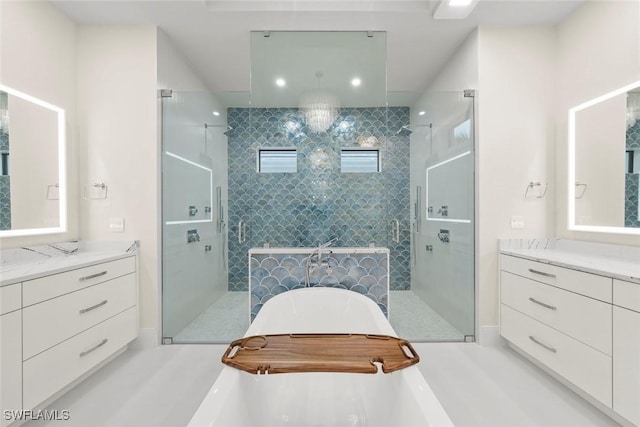 bathroom featuring walk in shower and vanity