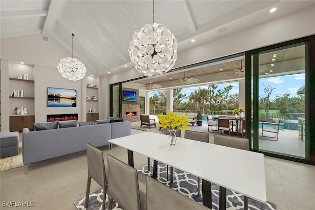 dining room with built in shelves, beamed ceiling, ceiling fan, and plenty of natural light