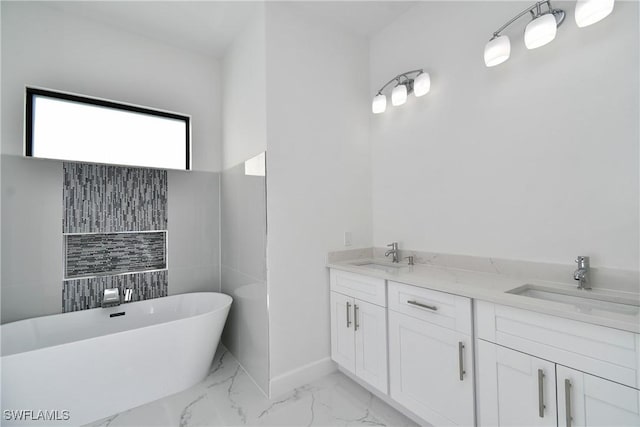 bathroom with vanity and a washtub