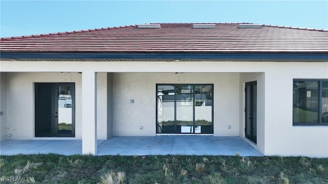 rear view of property with a patio area