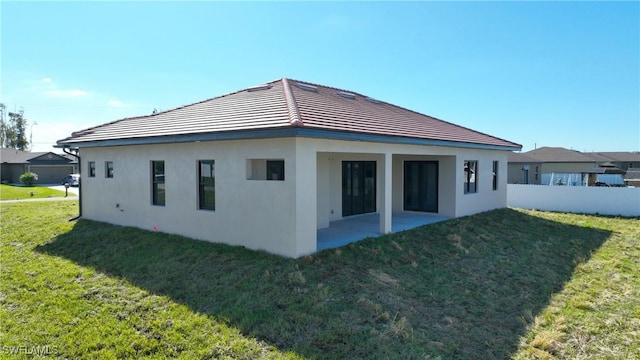 view of property exterior featuring a patio and a yard