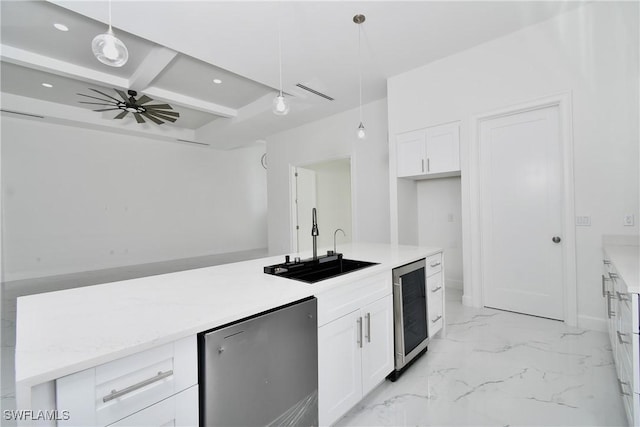 kitchen with pendant lighting, wine cooler, and white cabinets