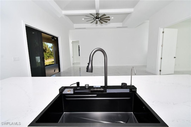 kitchen with beam ceiling and sink