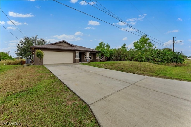 view of front facade with a garage, central AC, and a front yard