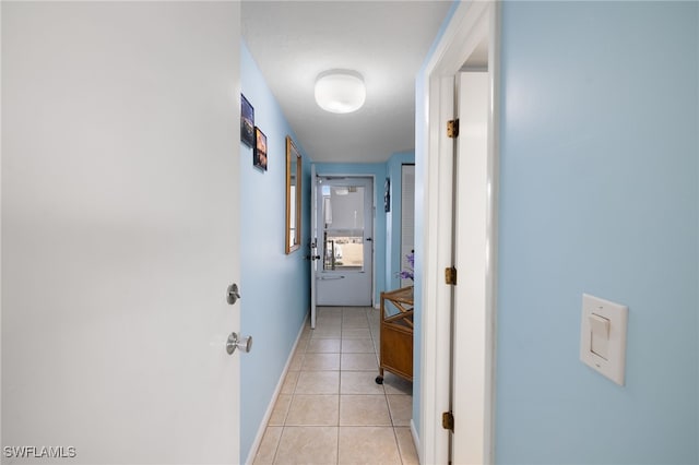 corridor with light tile patterned floors