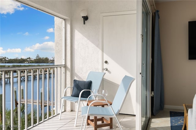 balcony featuring a water view