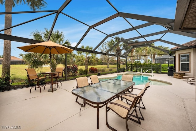 view of patio / terrace featuring a swimming pool with hot tub, a lanai, and area for grilling