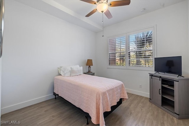 bedroom with ceiling fan and light wood-type flooring