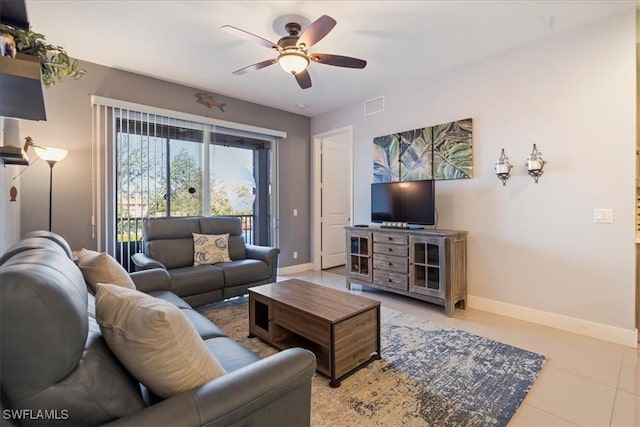 tiled living room featuring ceiling fan