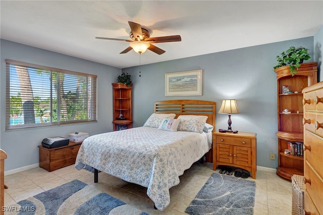 bedroom featuring ceiling fan and light tile patterned flooring