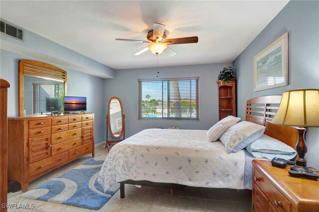 bedroom featuring tile patterned flooring and ceiling fan