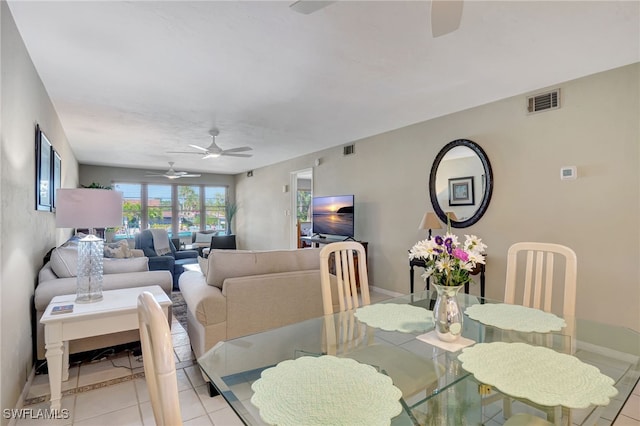 dining room featuring light tile patterned floors and ceiling fan