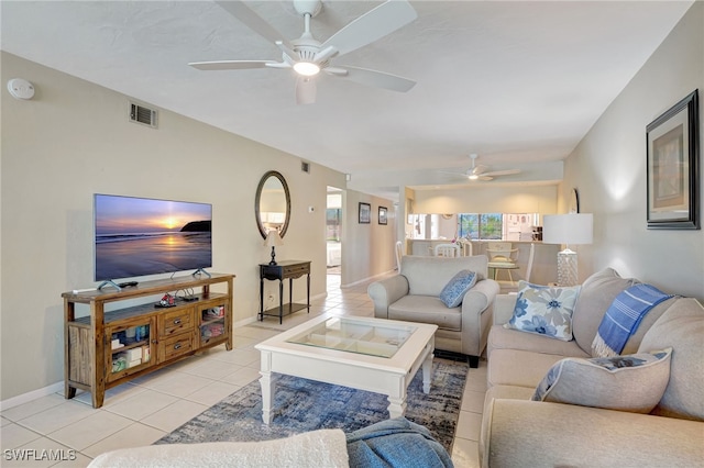 tiled living room with ceiling fan