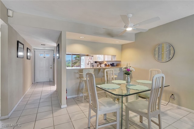 dining room with ceiling fan and light tile patterned floors